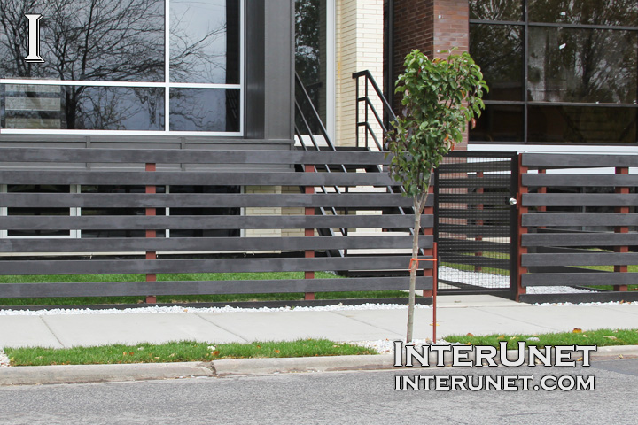 black-wood-horizontal-fence-on-metal-posts