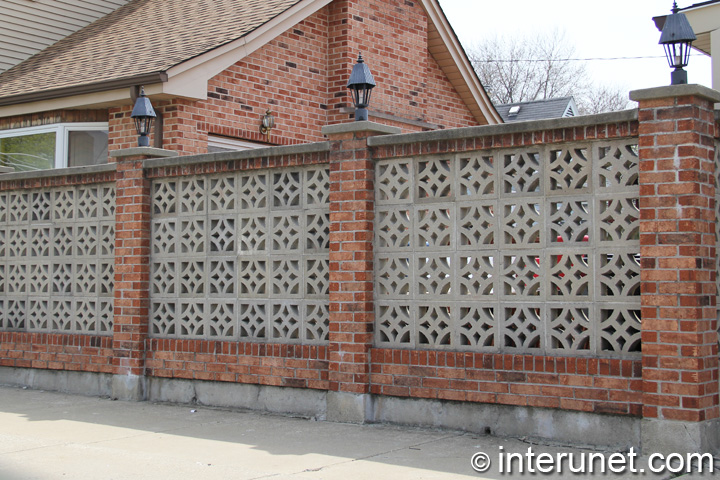 brick fence brick-fence-with-concrete-blocks-and-lights-on-pillars