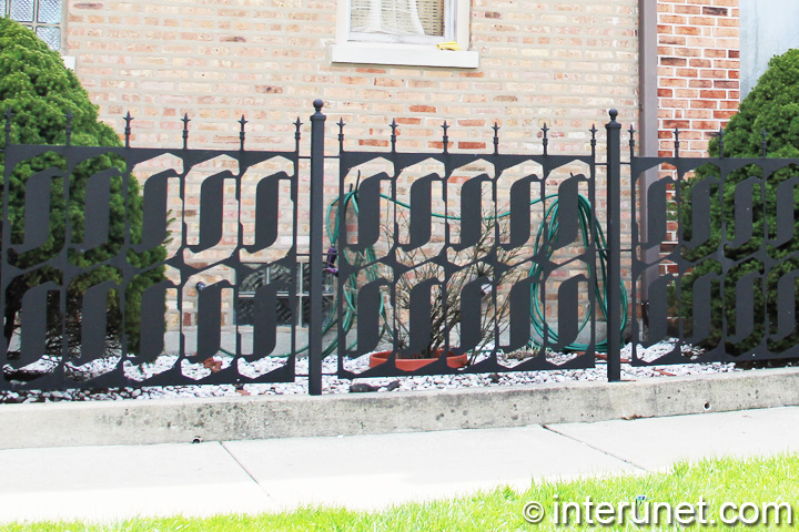 custom designed fence custom-designed-metal-fence-on-concrete-foundation