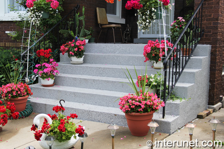 concrete front porch stairs-and-concrete-front-porch-decorated