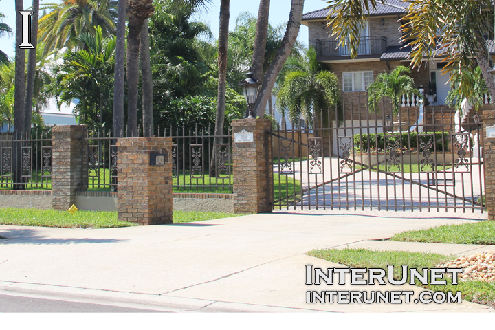 steel-fence-on-brick-pillars