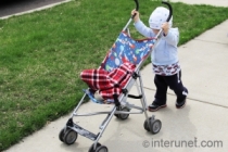 child-with-stroller child-pushing-stroller