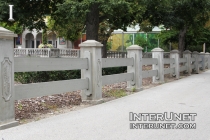 two-rail-fence-with-concrete-pillars