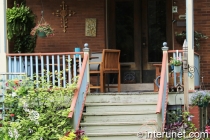 wood-porch-decorated-with-flowers