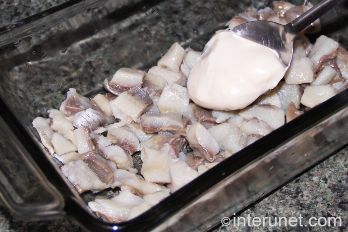 fish with mayonnaise adding-mayonnaise-on-top-of-fish