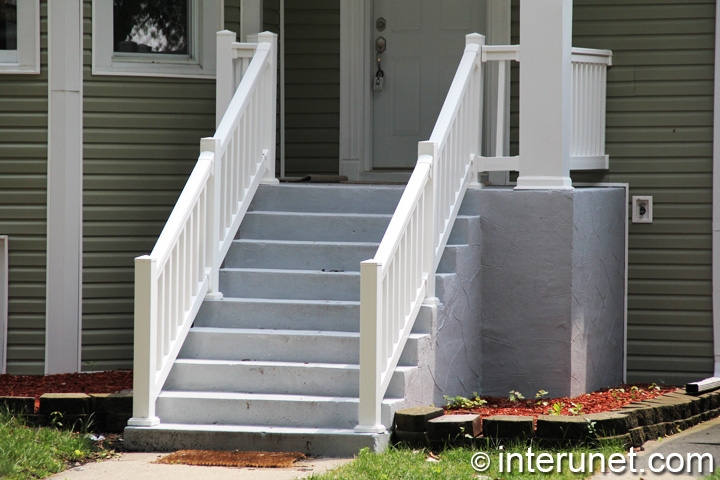 concrete-porch-and-stairs-with-white-balustrades