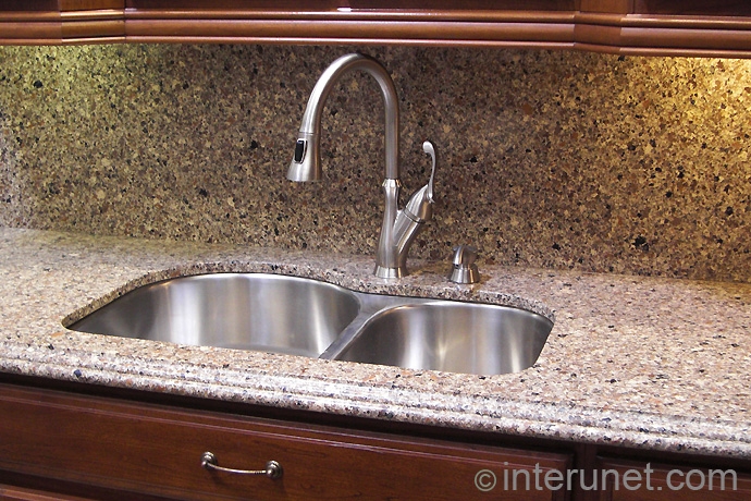 synthetic-stone-countertop-with-undermount-sink-and-kitchen-faucet