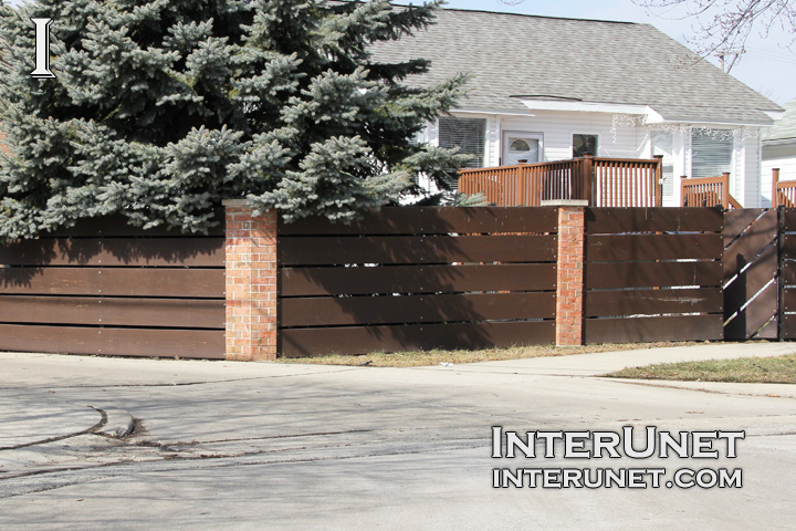 wood fence wide-horizontal-wood-boards-on-brick-pillars