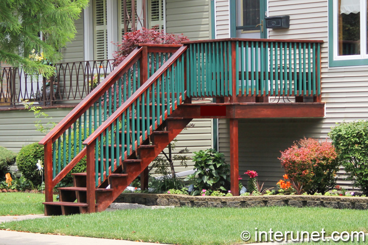 wood front porch wood-front-porch-pained-red-green-colors