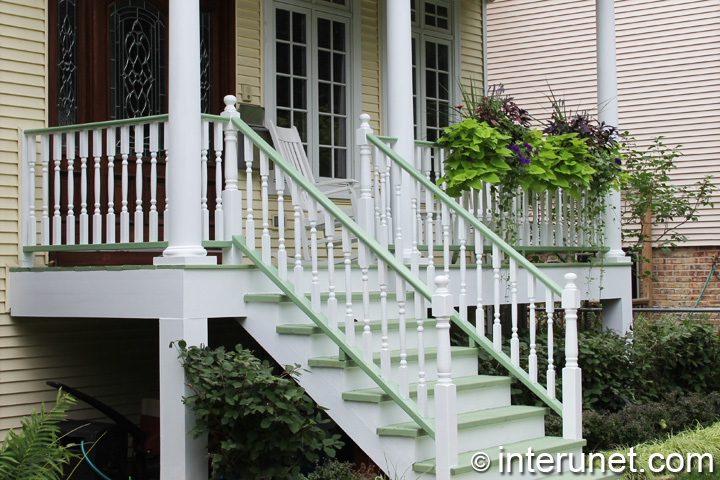 wood front porch wood-porch-painted-white-and-decorated-with-plants