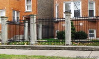 metal-fence-with-concrete-posts