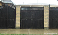 older-wood-fence-with-brick-pillars