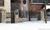 stone-pillars-steel-fence